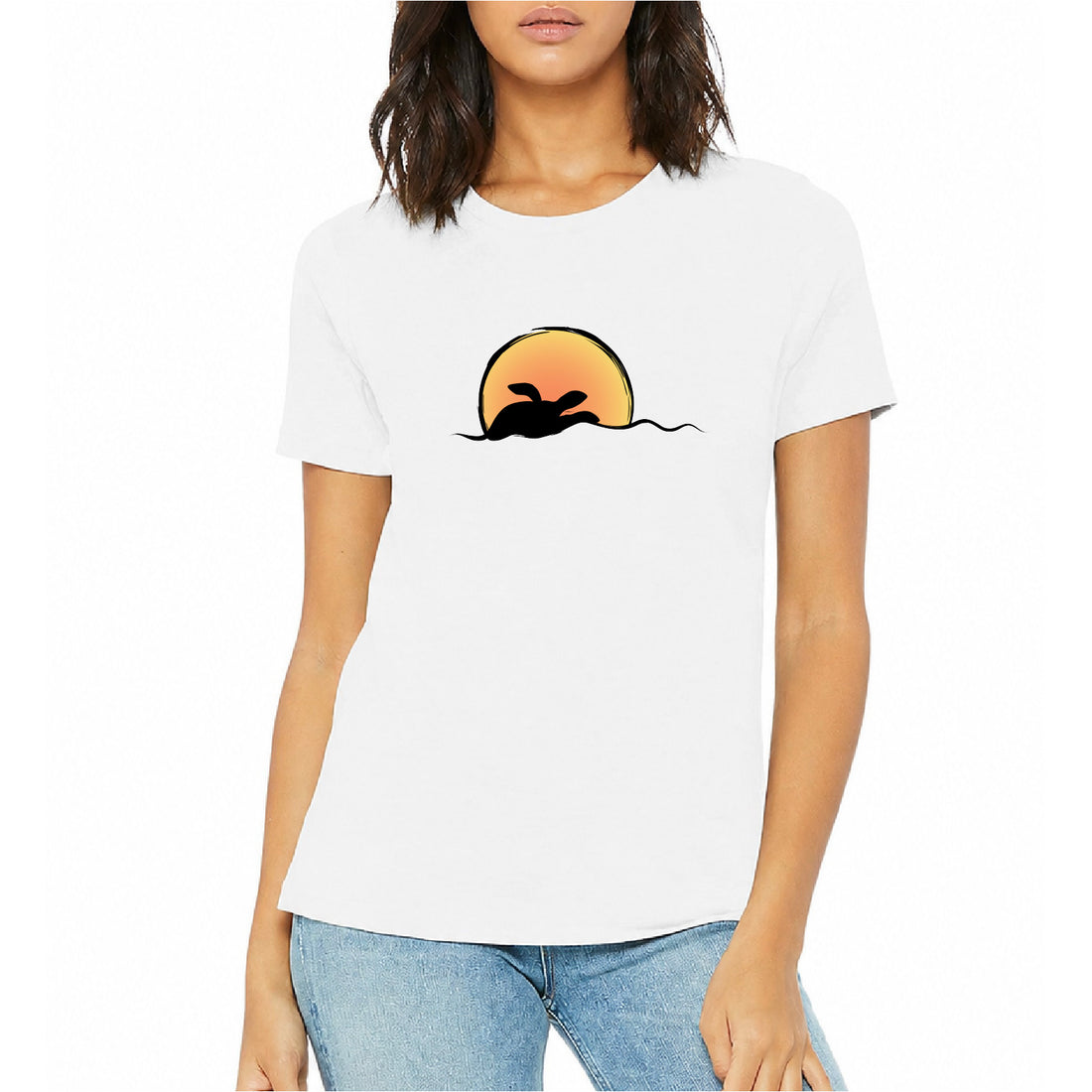 Woman wearing a white t-shirt with a graphic design of a sun and a sea turtle silhouette on a white background