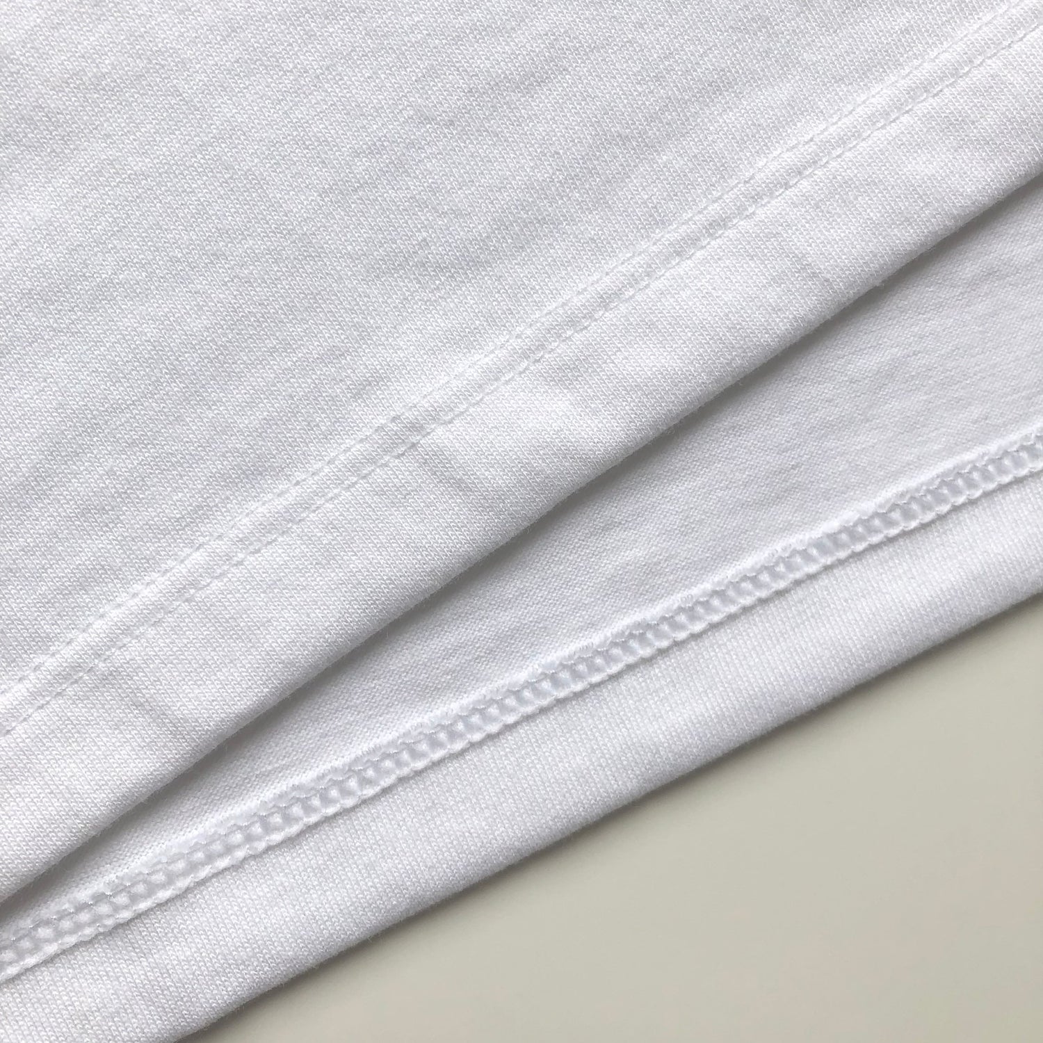 Super Soft Relaxed Lightweight Premium Blend White T-shirt Bottom Hem 