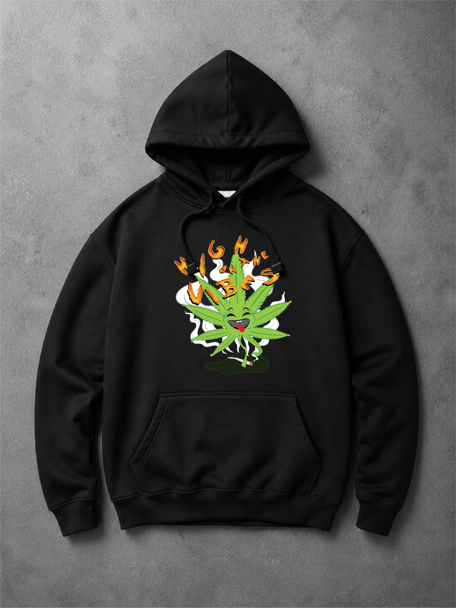 Black hoodie with a colorful "High On the Vibes" with laughing weed cargtoon art on a concrete  backgroundo.